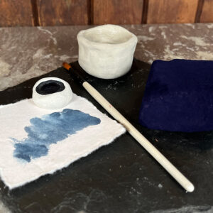 Indigo pigment paint in clay pot